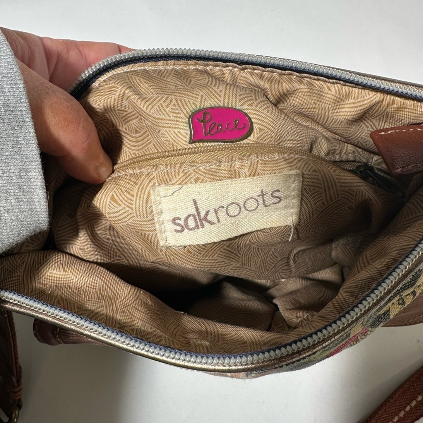 Sakroots Brown Crossbody Bag with Floral Design