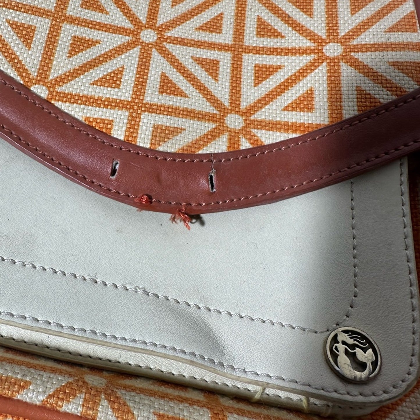 Orange and Cream Geometric Crossbody Bag with Flap Closure