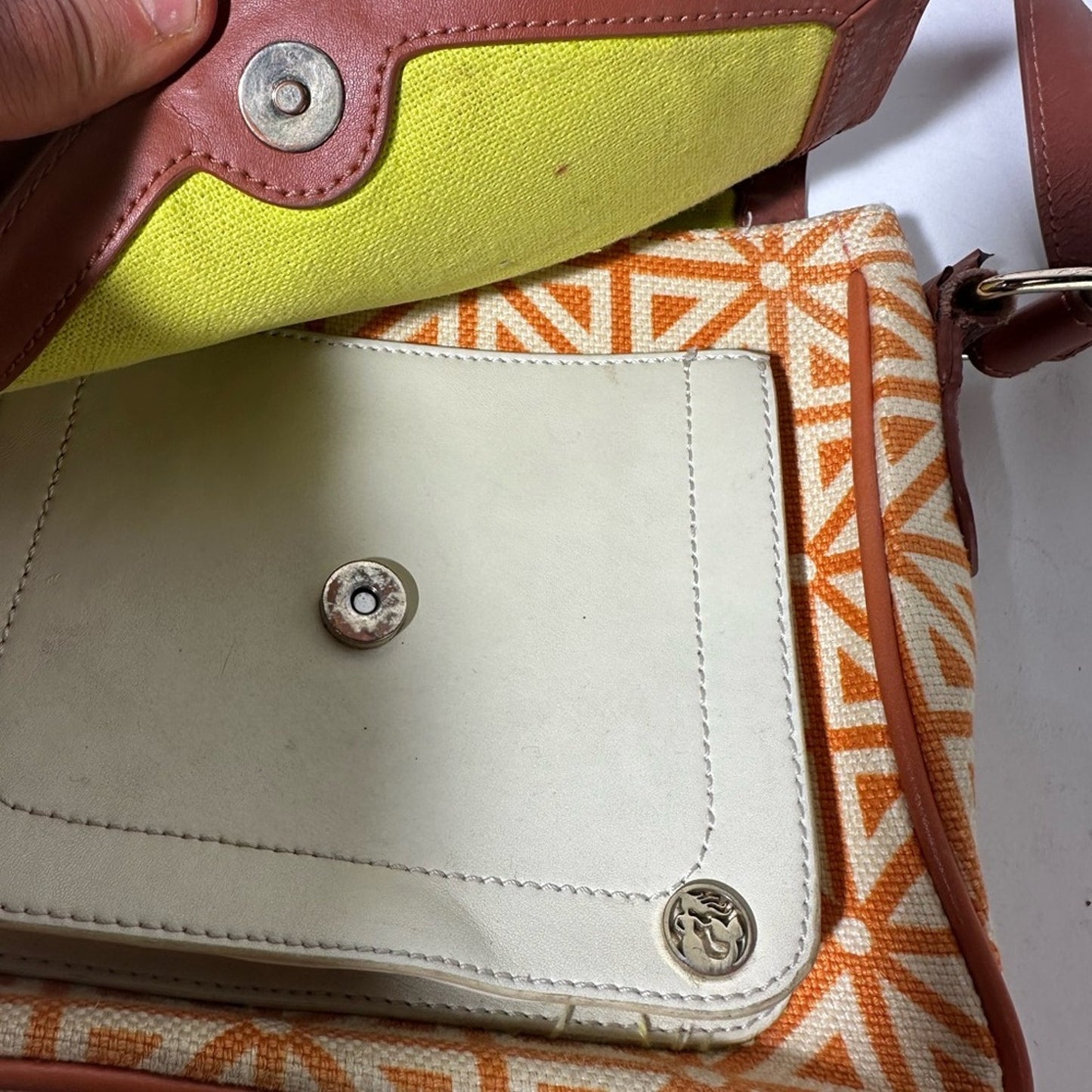 Orange and Cream Geometric Crossbody Bag with Flap Closure
