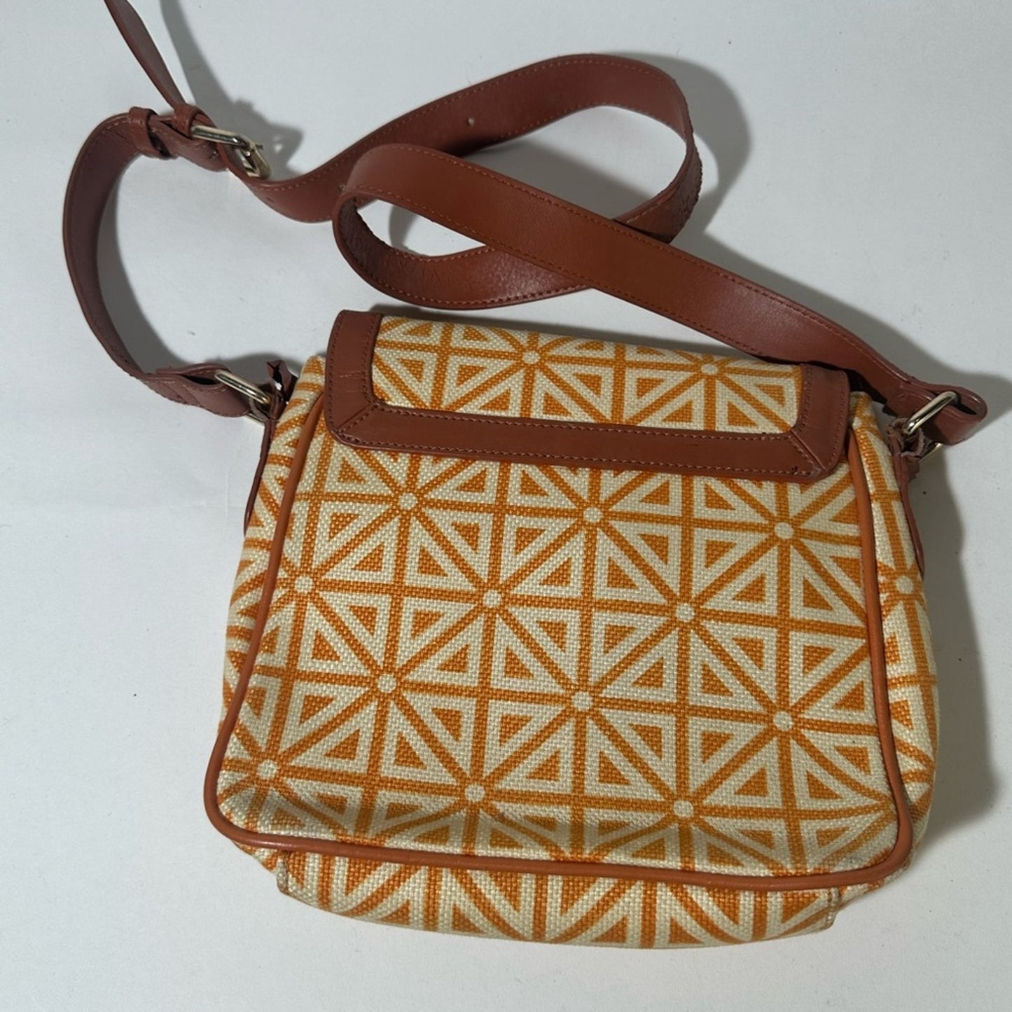 Orange and Cream Geometric Crossbody Bag with Flap Closure