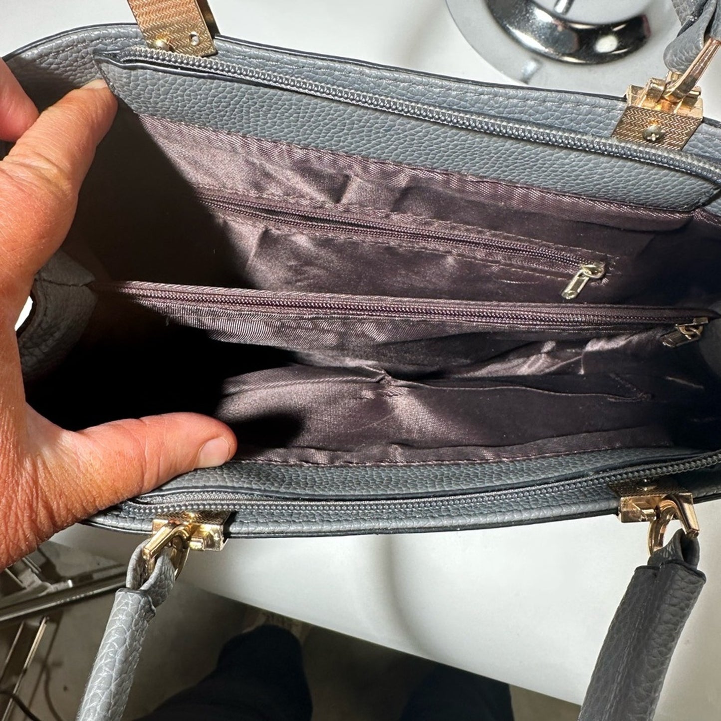 Gray Satchel with Structured Design and Gold Accents
