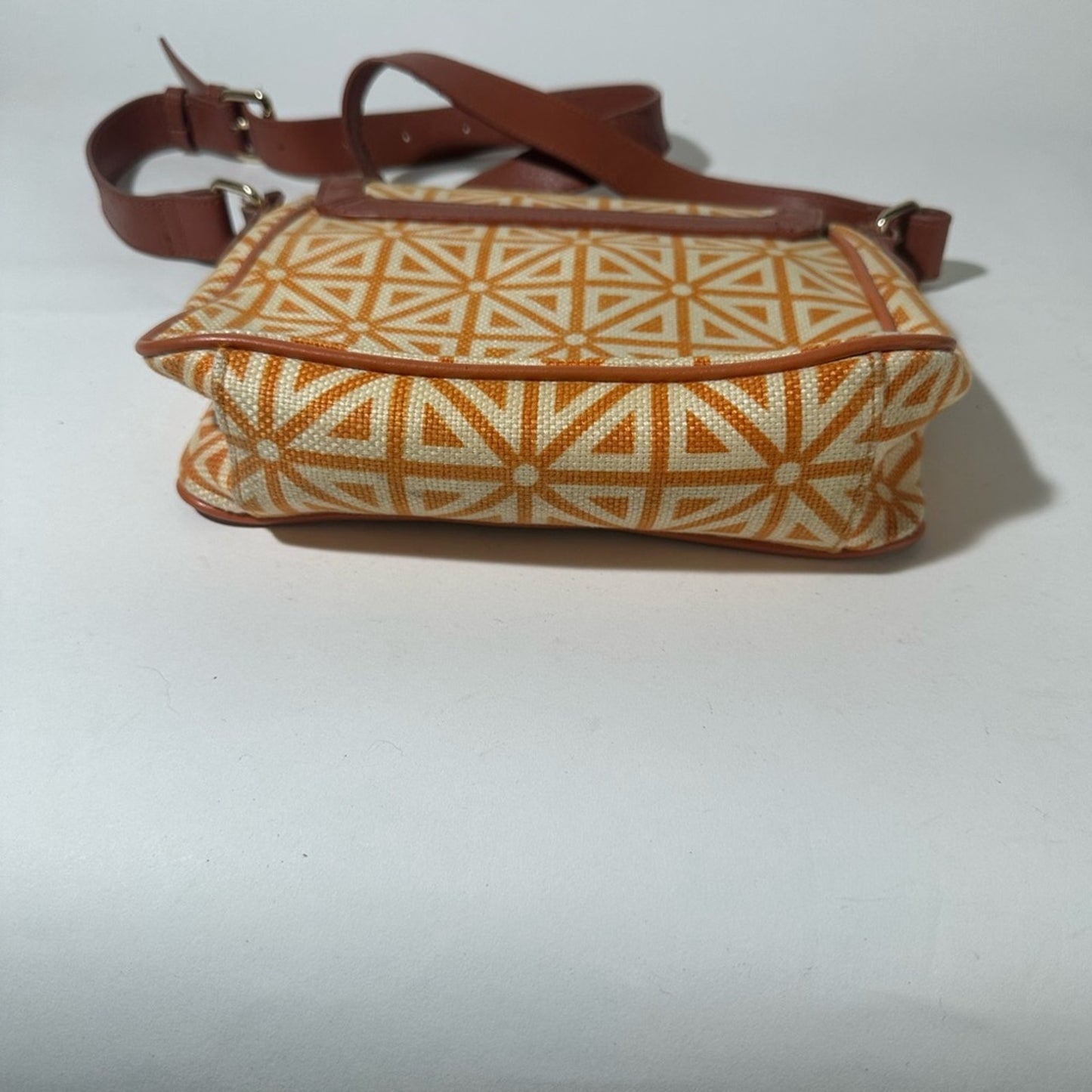 Orange and Cream Geometric Crossbody Bag with Flap Closure