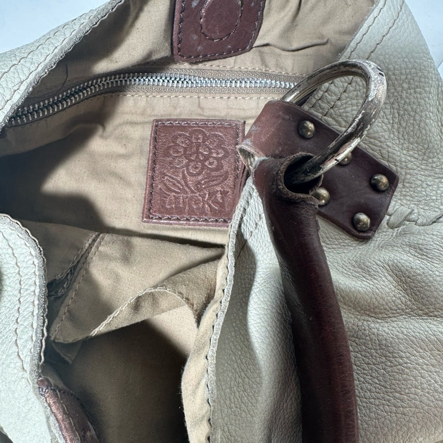 White and Brown Hobo Bag with Textured Leather and Slouchy Shape
